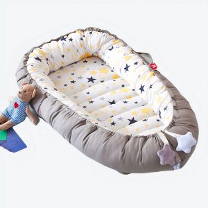 Couffin réducteur de lit avec étoiles pour bébé
